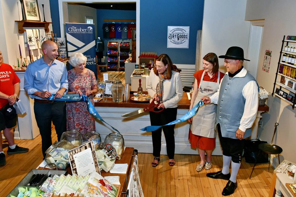 HBMS-President-CEO-LoriAnn-Wukitsch-cuts-the-ribbon-in-honor-of-the-Schropp-Dry-Goods-Shoppes-grand-opening
