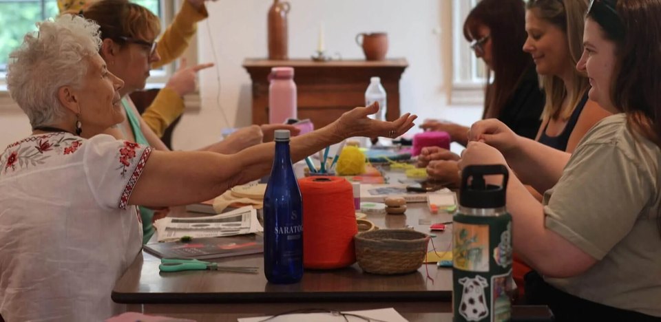 A group of women making crafts during a ladies weekend crafting retreat in Bethlehem, PA